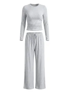 Close-up view of the grey long-sleeve ruched crop top and wide-leg lounge pants set.