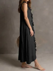 Detailed shot of elegant black sleeveless ruffle dress, stylish long linen silhouette.