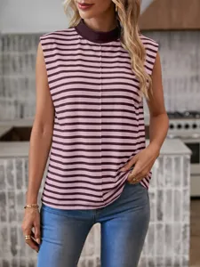 Detailed view of women casual striped sleeveless mock neck top paired with slim fit blue jeans.