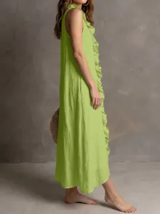Detail view of the sleeveless linen french dress featuring chic front ruffles and solid color.