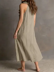 Back detail view of the elegant sleeveless linen ruffle midi dress for summer fashion.