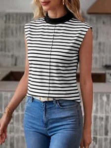 Close-up detail view of the black and white striped sleeveless top and denim jeans.