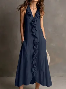 Close-up detail of solid color sleeveless V-neck ruffle maxi dress with handy pockets.