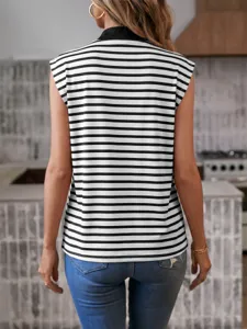 Back view detail of casual black white striped sleeveless vest paired with denim jeans.
