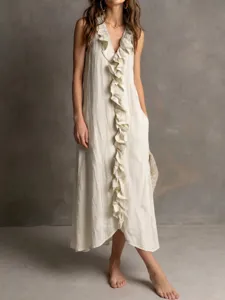Detailed view of women's sleeveless maxi dress with front ruffle and V-neckline design.