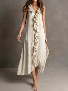 Detail view of a solid sleeveless V-neck linen maxi dress featuring a chic front ruffle trim.
