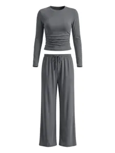 Solid color long sleeve crop top and wide leg lounge pants set in dark grey, casual detail.