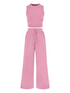 Pink ribbed two-piece set featuring a slim cropped tank top and high-waisted wide-leg pants detail.