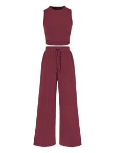 Ribbed two piece set featuring a slim crop tank top and high waist wide leg pants, burgundy.