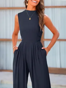 Sleeveless navy blue ribbed jumpsuit with wide legs. Comfortable loose fit casual wear for women.
