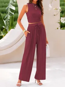Solid ribbed two-piece set featuring a slim crop tank top and high-waist wide-leg pants.