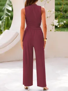 Stylish solid color two piece sleeveless crop top and high waist wide leg pants set for women.