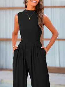 Detail view of the black sleeveless jumpsuit showing the wide-leg cut and soft ribbed texture.