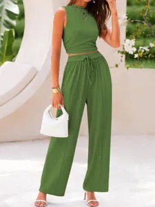 Detailed view of the ribbed knit crop top and high waist wide leg pants set in green.