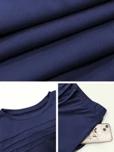 Close-up details of women casual two-piece set, fabric texture, pleated neckline and pants.