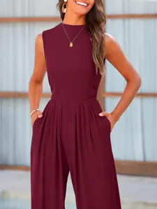 Close-up detail of the burgundy ribbed sleeveless jumpsuit pocket and fabric texture.