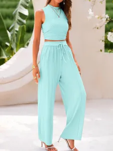 Solid color ribbed two-piece set featuring a cropped tank top and high waist wide leg pants.