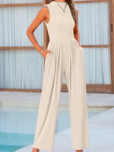 Beige sleeveless wide-leg jumpsuit detail showing relaxed fit, waist cinch, and handy side pockets.