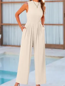 Detail shot of the sleeveless beige wide-leg jumpsuit featuring comfortable high waist and pockets.