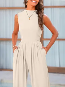 Sleeveless beige jumpsuit with wide-leg design and practical side pockets for everyday wear.