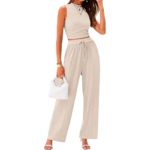 Solid color ribbed two-piece outfit featuring a slim crop tank top and high waist wide leg pants.