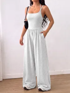 Grey sleeveless halter wide leg jumpsuit, stylish casual summer one-piece outfit detail.