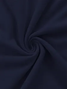 Detailed close-up of dark blue fabric texture showing soft material swirl and fine knit.
