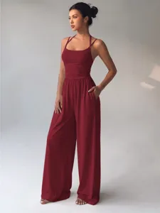Red spaghetti strap halter wide leg jumpsuit detail view, casual summer fashion style.