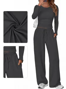 Detail view of dark grey loungewear set fabric texture and pocket design features.
