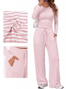 Detailed close-up view of pink and white striped lounge set fabric texture and pocket design.