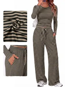 Close-up details of striped long sleeve top and wide leg pants set showing fabric and pocket.