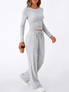 Detailed view of the stylish grey two-piece loungewear set featuring long sleeves and wide pants.