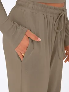 Ribbed lounge set pocket detail showing soft fabric, elastic drawstring waist, and long sleeves.