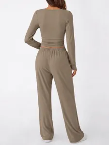 Detailed back view of casual two-piece lounge set, long sleeve top and pants in taupe color.