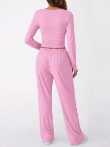 Back view detail of women pink long sleeve top and pants casual lounge set fit design.