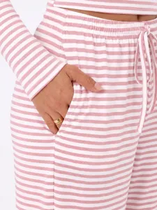 Pink white striped lounge set detail view, soft long sleeve top and pocket pants.