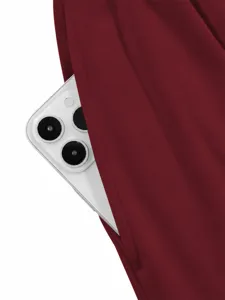 Detailed shot of deep pocket on solid wine red casual pants, showing practical design.