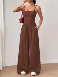Detail view of women's casual brown halter tube top wide leg jumpsuit, summer fashion.