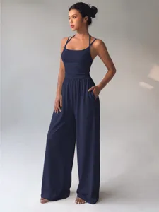 Detail view of the navy blue halterneck wide-leg jumpsuit for summer daily wear.