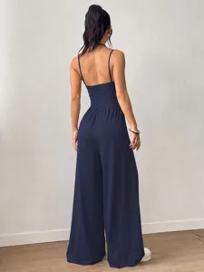 Back view detail of a chic navy blue strapless wide-leg jumpsuit for summer style.