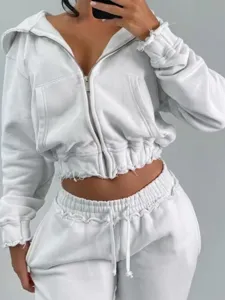 White cropped zip hoodie and sweatpants set, raw edge casual athleisure two-piece outfit.
