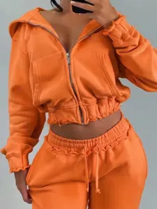 Orange cropped zip hoodie and sweatpants set, raw edge design for casual daily wear.