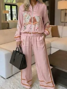 Pink vintage colorblock two-piece set featuring a stand collar zip jacket and wide leg pants.