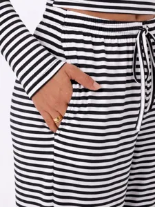 Black and white striped long sleeve casual lounge set with pocket and drawstring waist for women.