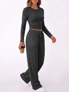 Striped two-piece loungewear set featuring a crew neck long sleeve top and wide leg pants.
