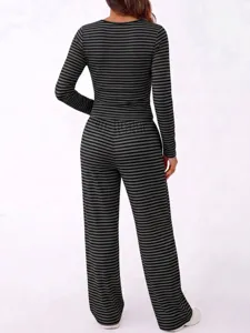 Rear view detail of women's casual black and grey striped lounge set with wide leg trousers.