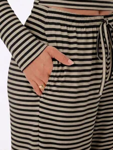 Casual striped loungewear set detail showcasing soft fabric, pocket, and drawstring waist.