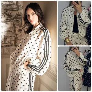 Polka dot track suit stand collar zip jacket and wide leg pants vintage sporty style.