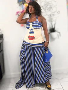 Detailed view of the fashionable striped halter top and long skirt set with red lip print.