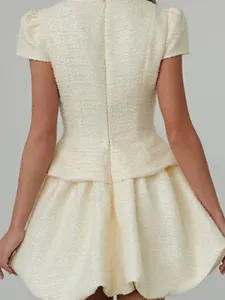 Ivory white tweed short dress with puff sleeves, peplum waist and chic bubble skirt design.